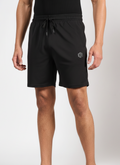 Person wearing Endeavour Wear Black Active Shorts on a white background